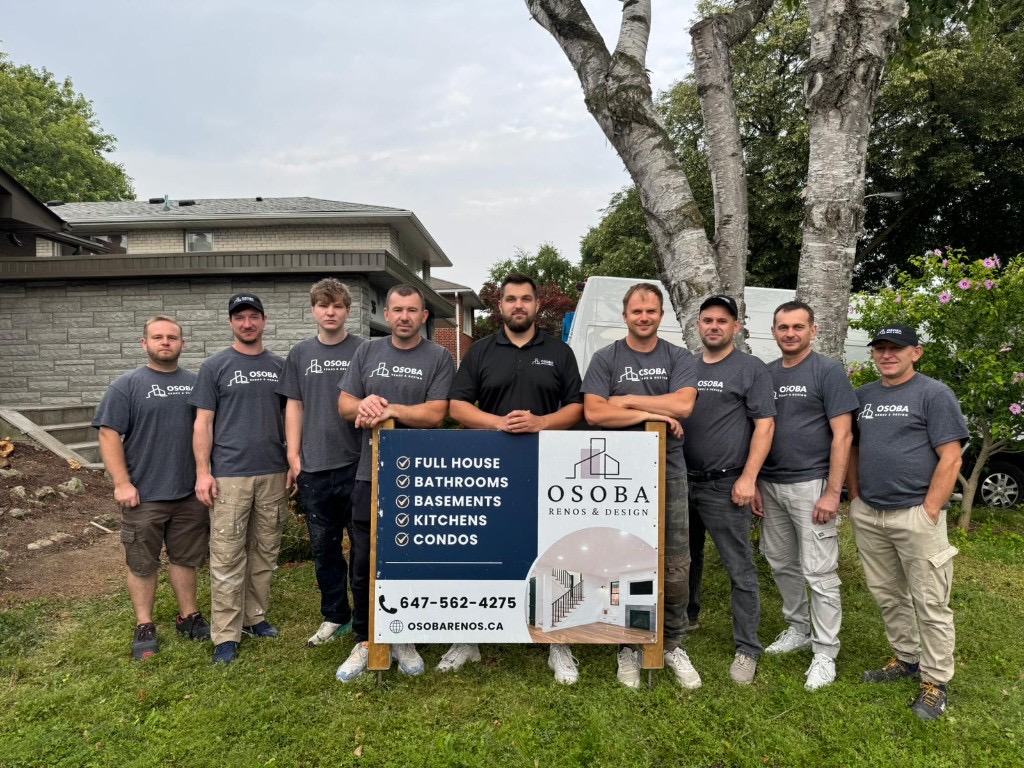 The Osoba Renos & Design crew standing on site in Mississauga with the company yard sign.