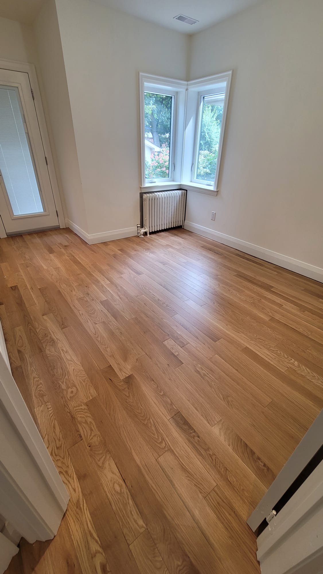 Hardwood floor and staircase renovation hallway