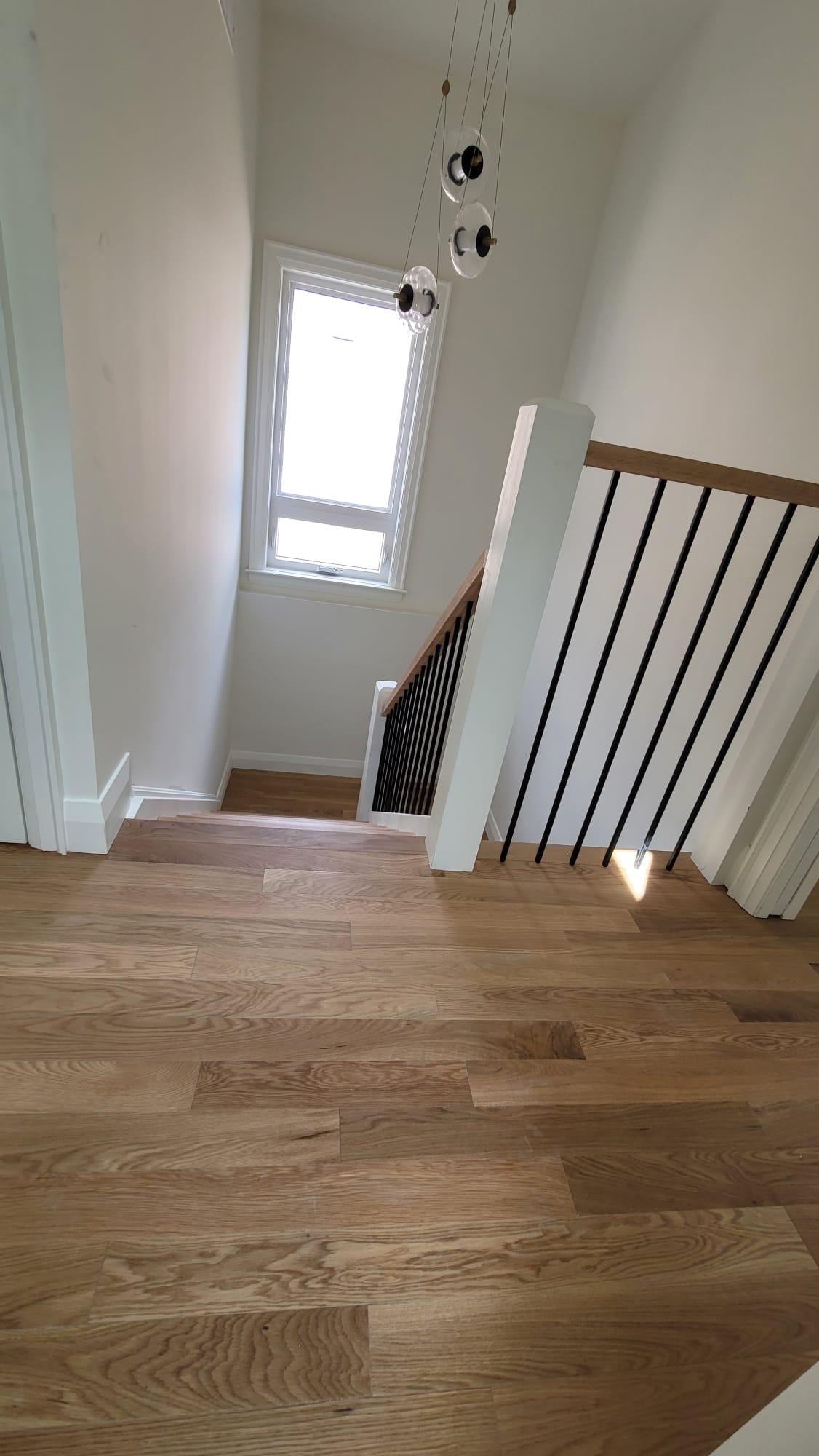 Hardwood floor staircase landing renovation