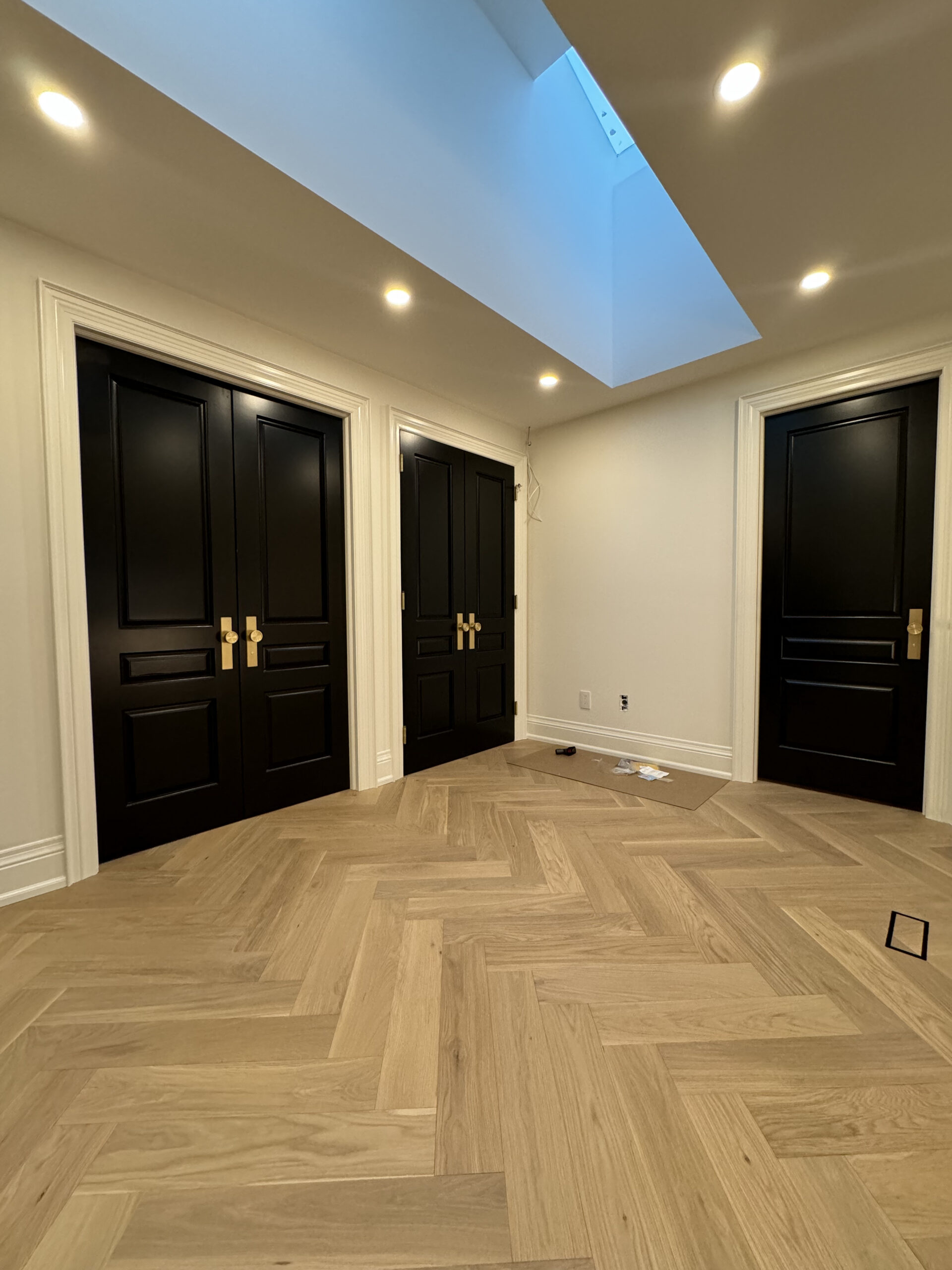 Hallway skylight and elegant herringbone floors