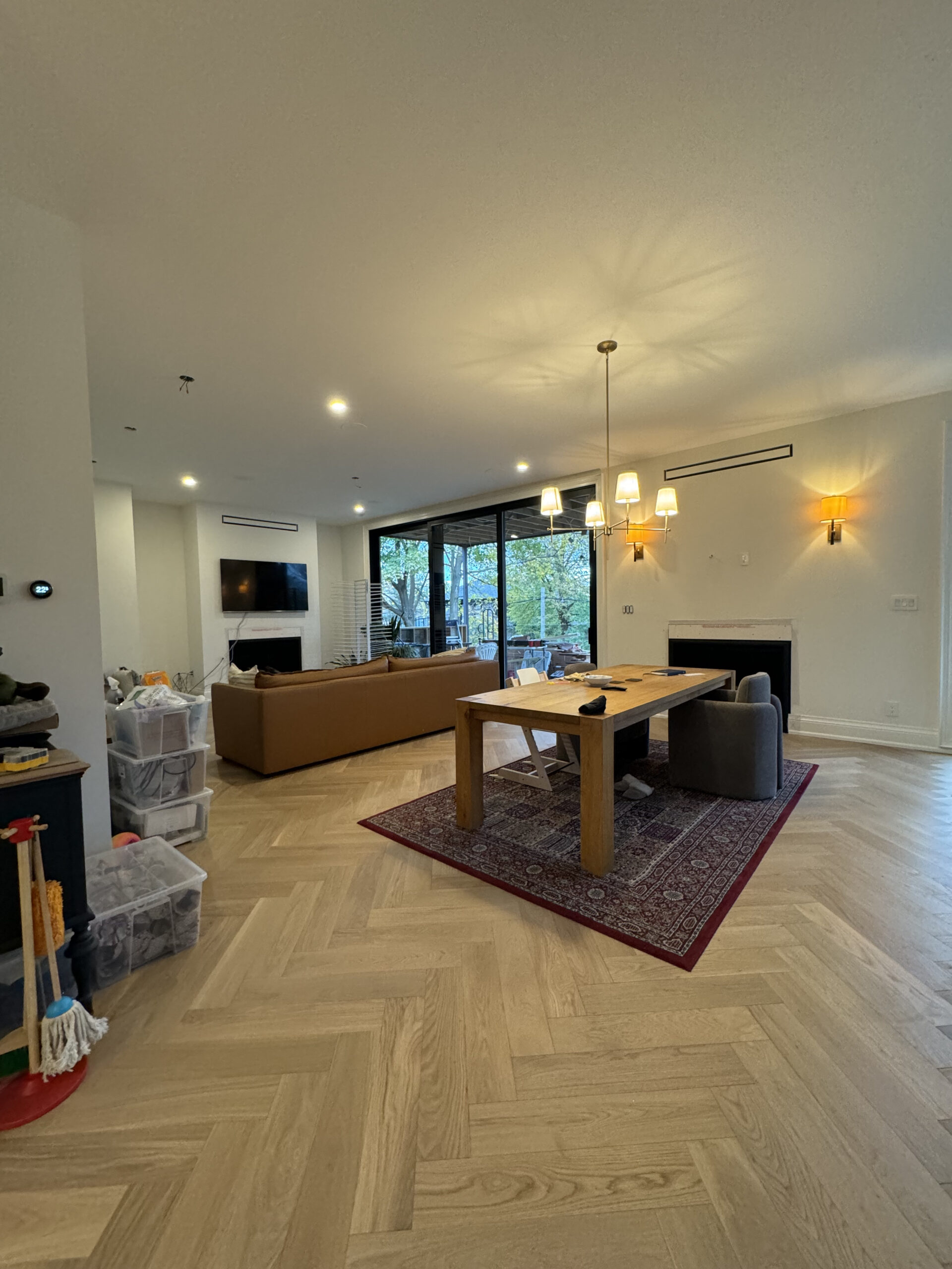 Living space herringbone flooring and natural light