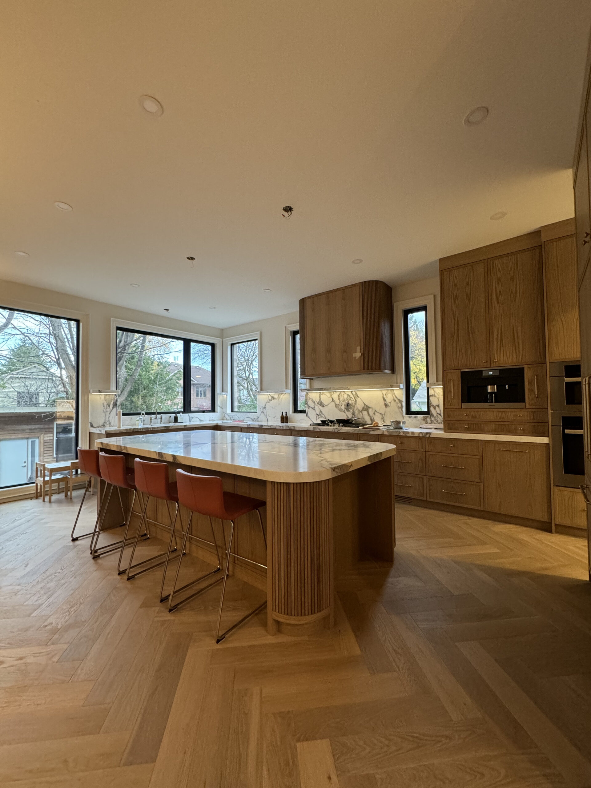 Luxury kitchen island and herringbone flooring