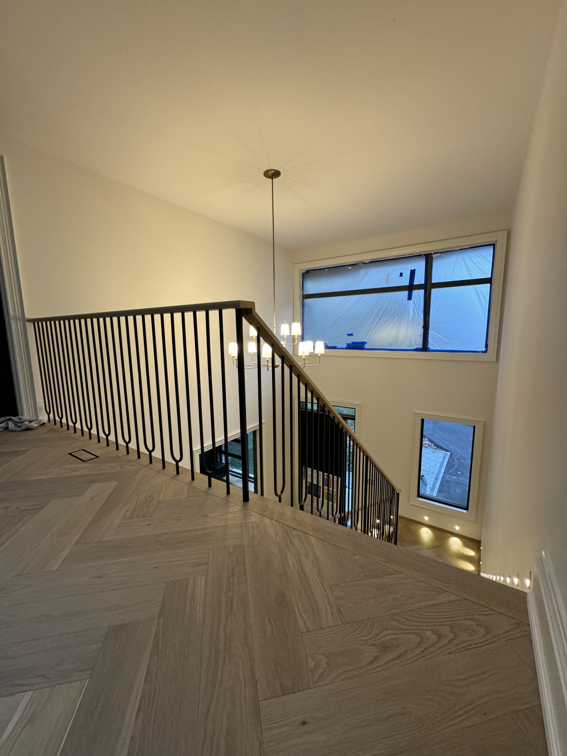 Upper landing skylight black doors herringbone flooring