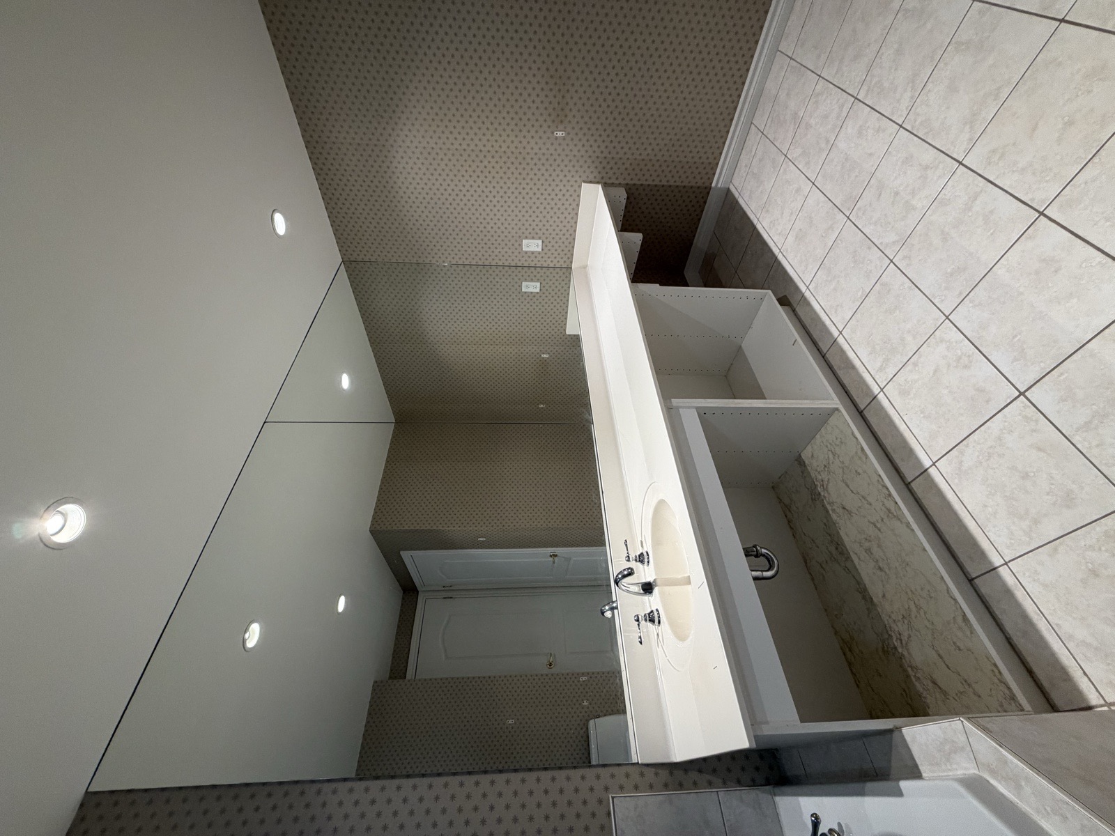 Mississauga luxury condo bathroom renovation before old vanity mirror