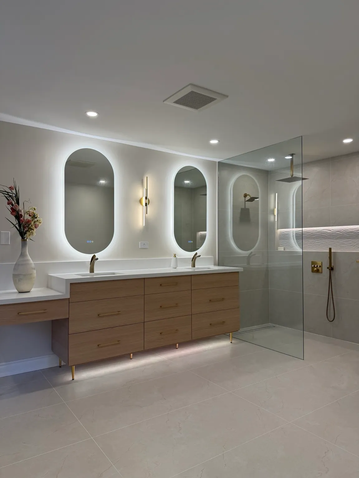 Luxury four-piece bathroom on Mississauga Road with double vanity, freestanding jacuzzi tub, and walk-in shower with custom hidden shelves.