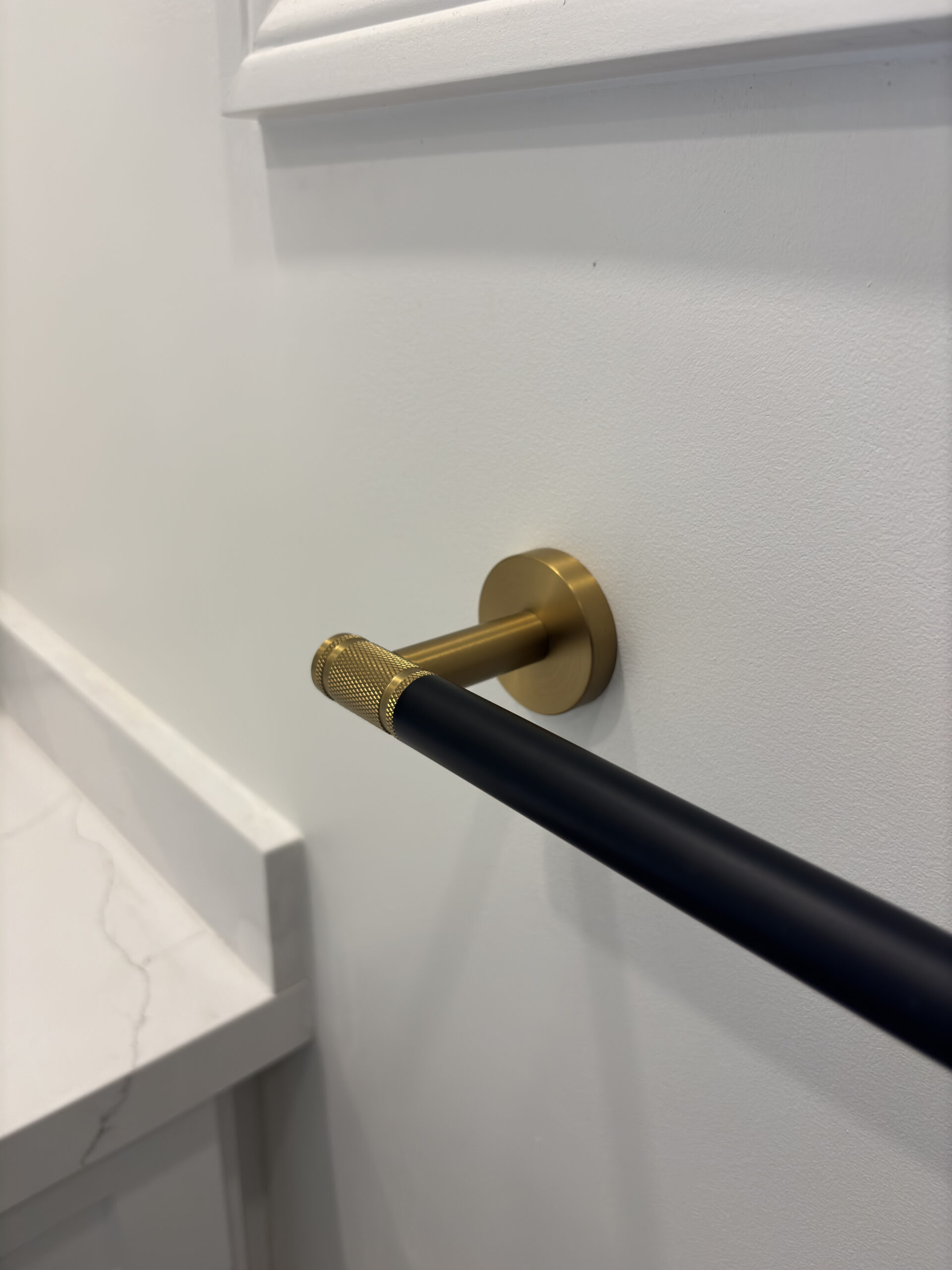 Oakville bathroom renovation black gold towel bar detail