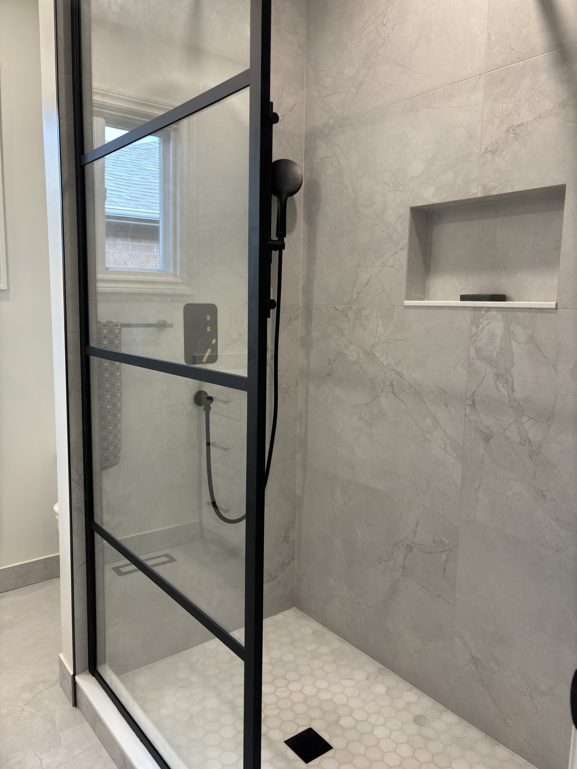 Oakville bathroom renovation glass shower panel matte black