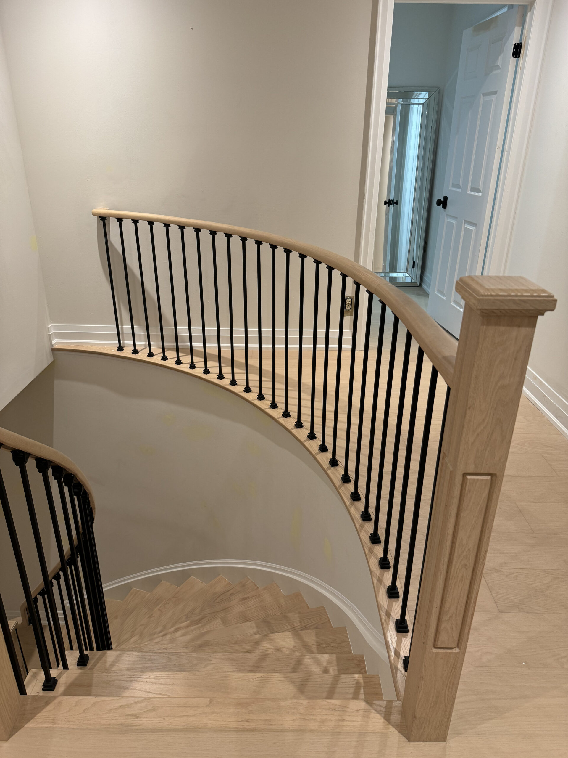 Elegant wooden staircase with modern railing