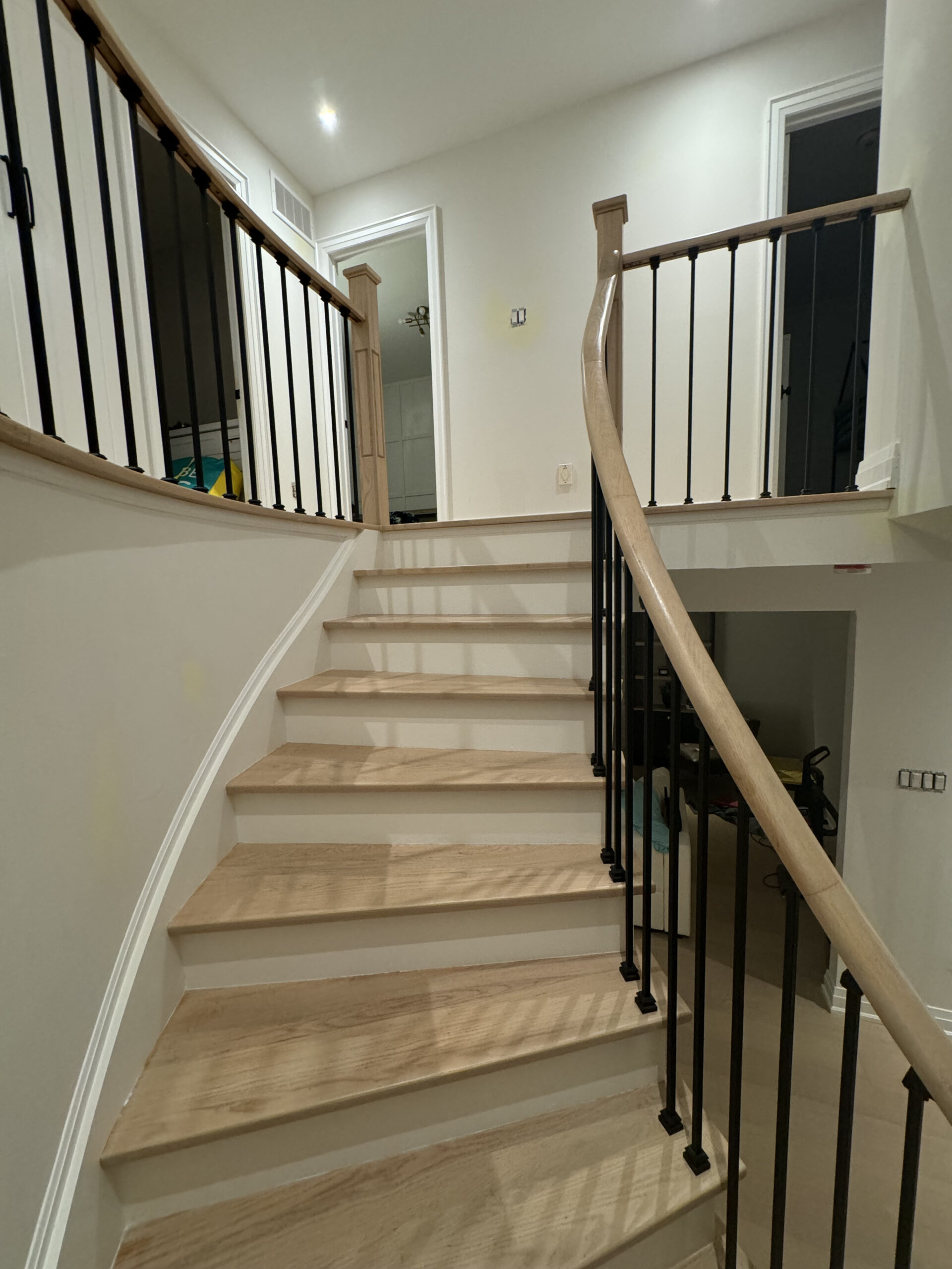Remodeled staircase top view black railings