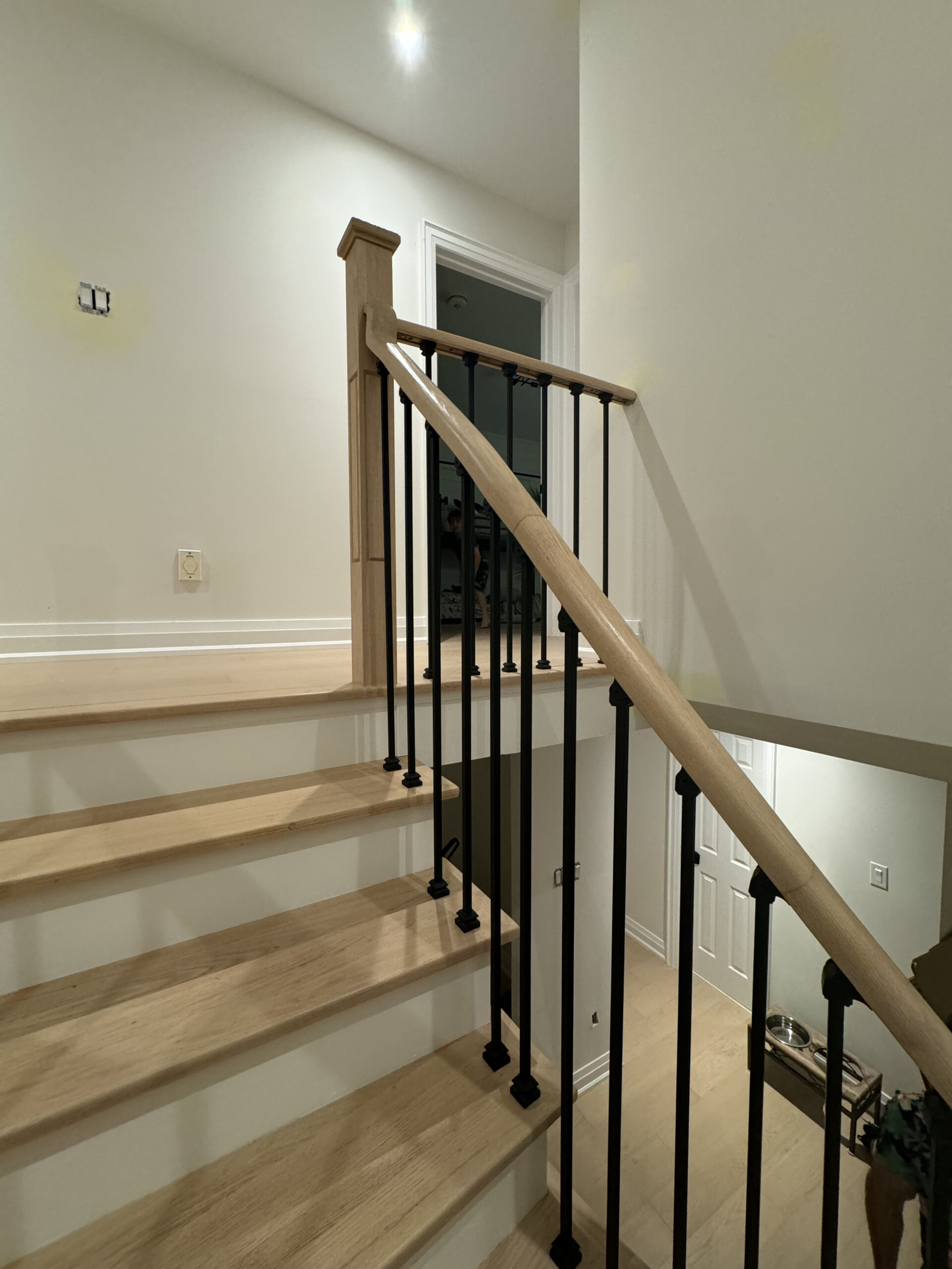 Staircase remodel wrought iron balusters oakville